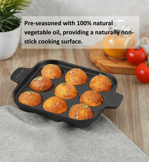 Black muffin tin with baked goods on a kitchen counter, featuring text about natural vegetable oil.