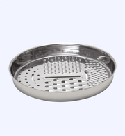 Stainless steel steamer basket on a light gray background