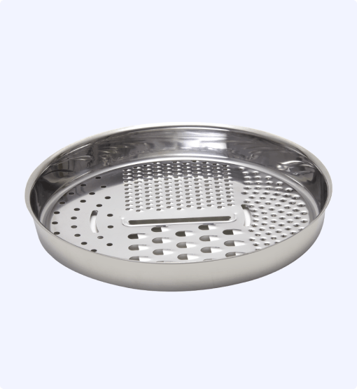 Stainless steel steamer basket on a light gray background