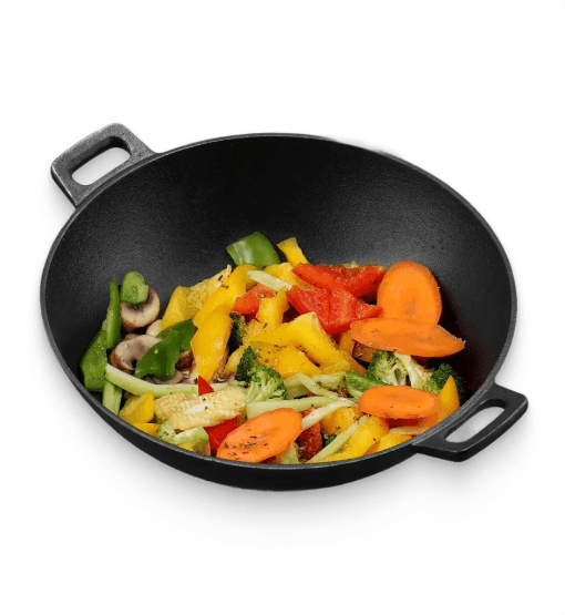 Black wok with colorful vegetables on a white background