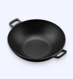 Black cast iron wok on a white background