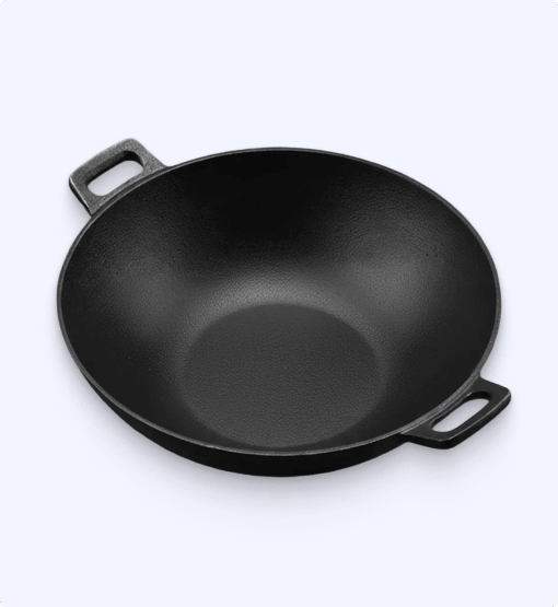 Black cast iron wok on a white background