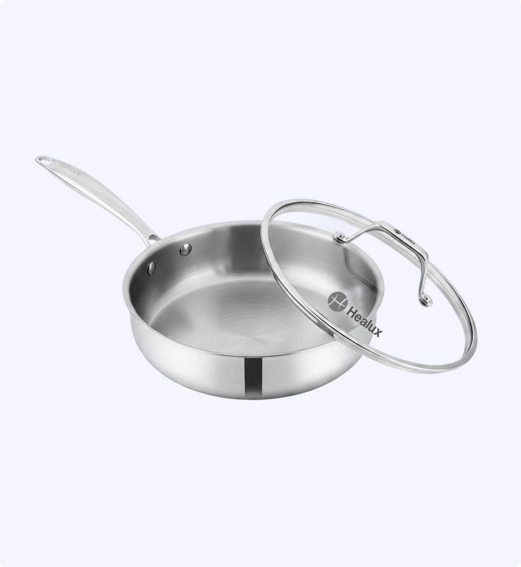 Stainless steel frying pan with lid on a white background