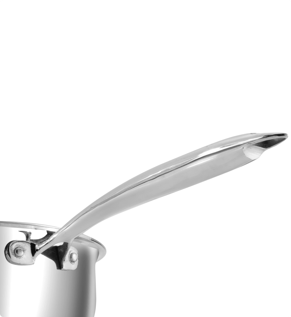 Close-up of a silver pot handle on a white background