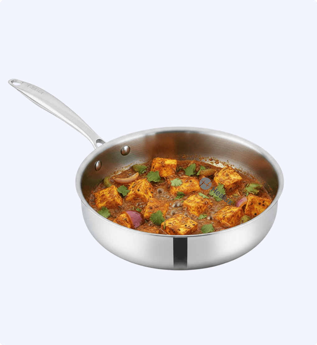 Stainless steel frying pan with tofu dish on a white background