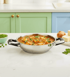 Stainless steel bowl with curry on a kitchen counter