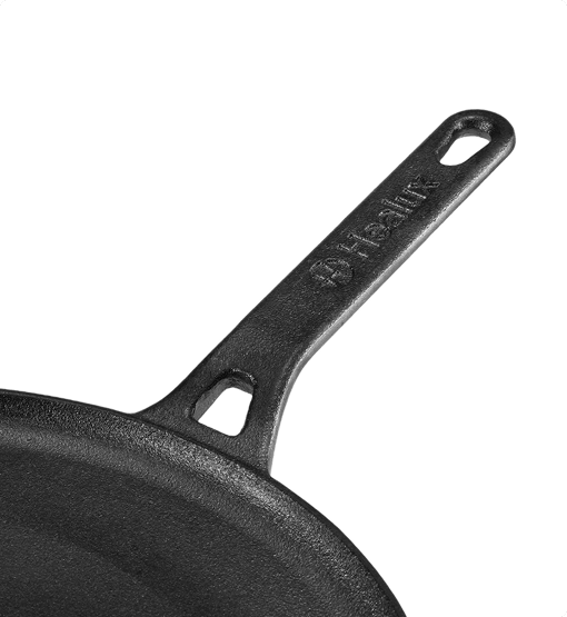 Black cast iron skillet with 'Fry Pan' branding on a white background