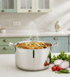Stovetop with a pot of food and vegetables on a kitchen counter