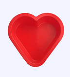 Red heart-shaped baking mold on a white background