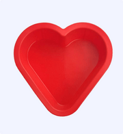 Red heart-shaped baking mold on a white background