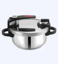 Stainless steel pressure cooker with digital display on a white background
