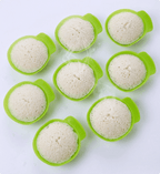 Silicone mold with baked goods on a white background