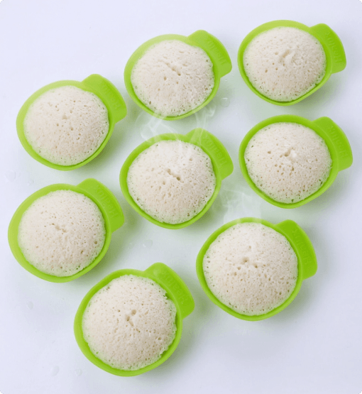 Silicone mold with baked goods on a white background
