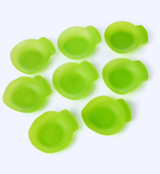 Green silicone mold shapes on a white background