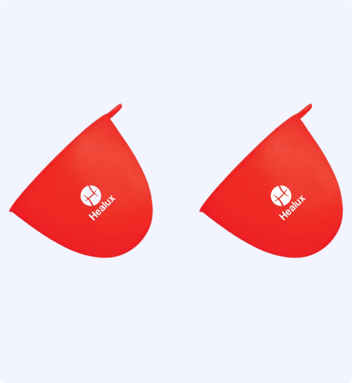 Two red silicone cups with 'Healux' logo on a white background