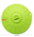 Green silicone lid with 'Healux' branding on a white background