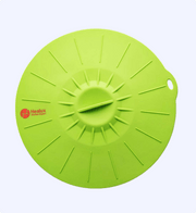 Green silicone lid with Healux logo on a white background
