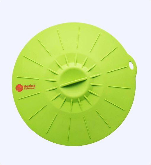 Green silicone lid with Healux logo on a white background