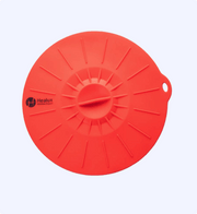 Red silicone lid with Healsix logo on a light gray background