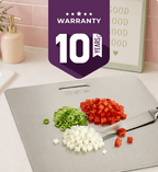 Chopping board with chopped vegetables and a 10-year warranty badge in a kitchen setting.