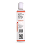 Back view of a white bottle with a red label on a white background