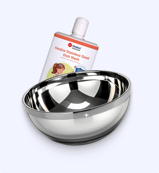 Stainless steel bowl with Healux dish wash bottle on a white background