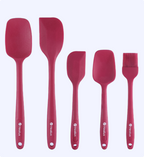 Set of red silicone kitchen utensils with 'Helix' branding on a white background