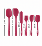 Set of red silicone kitchen utensils with measurements on a white background