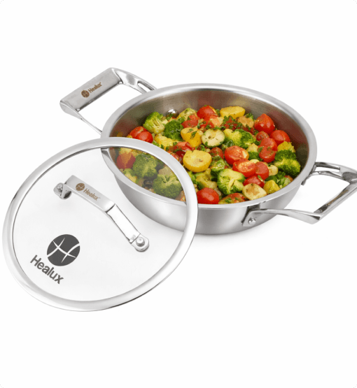 Stainless steel cookware set with vegetables inside on a white background, featuring the Healux brand.