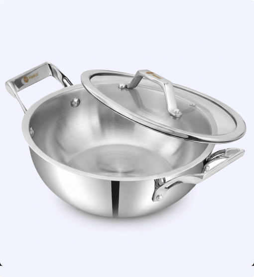 Stainless steel pot with lid on a white background