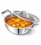 Stainless steel wok with food inside on a white background