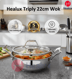 Healux Triply 22cm Wok with lid on a kitchen counter, featuring brand logos and product features.