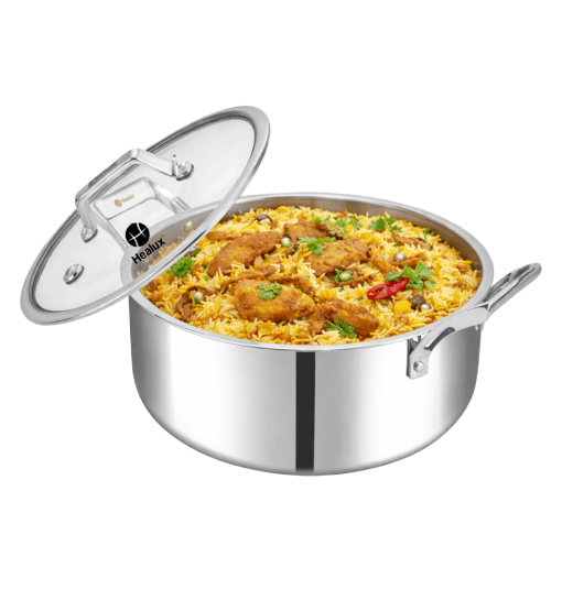 Stainless steel pot with food inside on a white background
