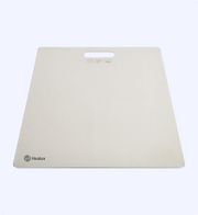 Beige mouse pad with Healux logo on a white background