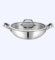 Stainless steel wok with lid on a white background