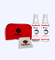 Healux homecare product set with red pouch, cloth, and two spray bottles on a white background