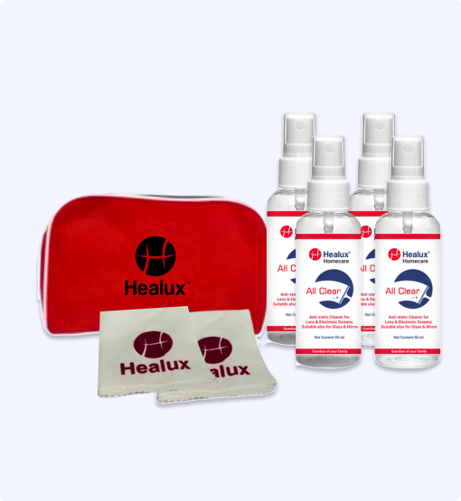Healux cleaning kit with red pouch, cloths, and multiple bottles on a white background