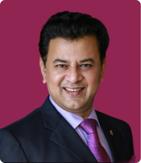 Man in a suit with a pink background