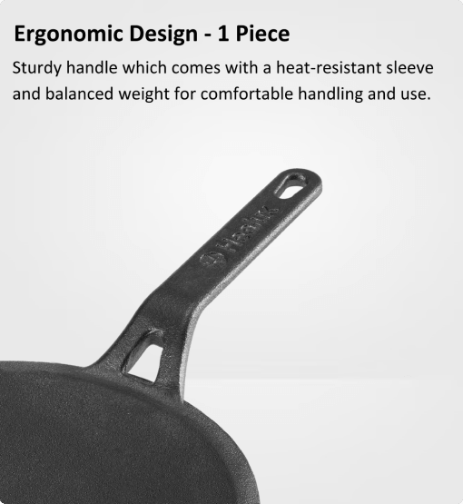 Black cast iron skillet with handle and heat-resistant sleeve on a white background